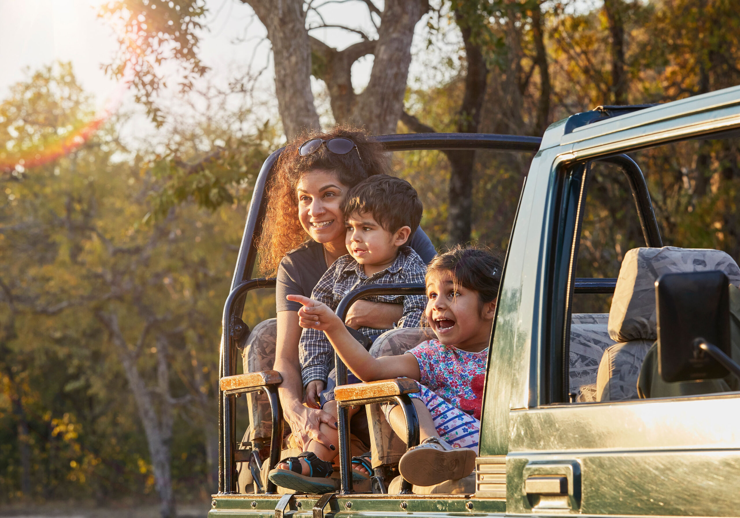 family-enjoying-a-safari-adventure-at-sunset-2024-07-04-19-48-14-utc